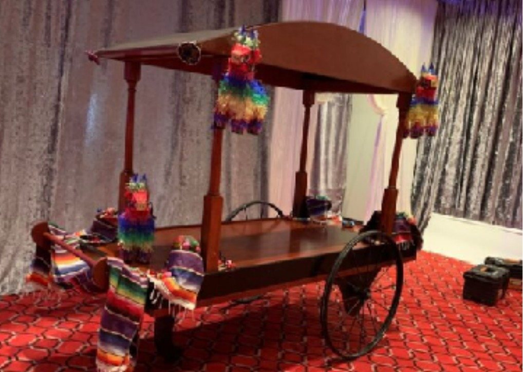Vendor cart with arched canopy and lanterns