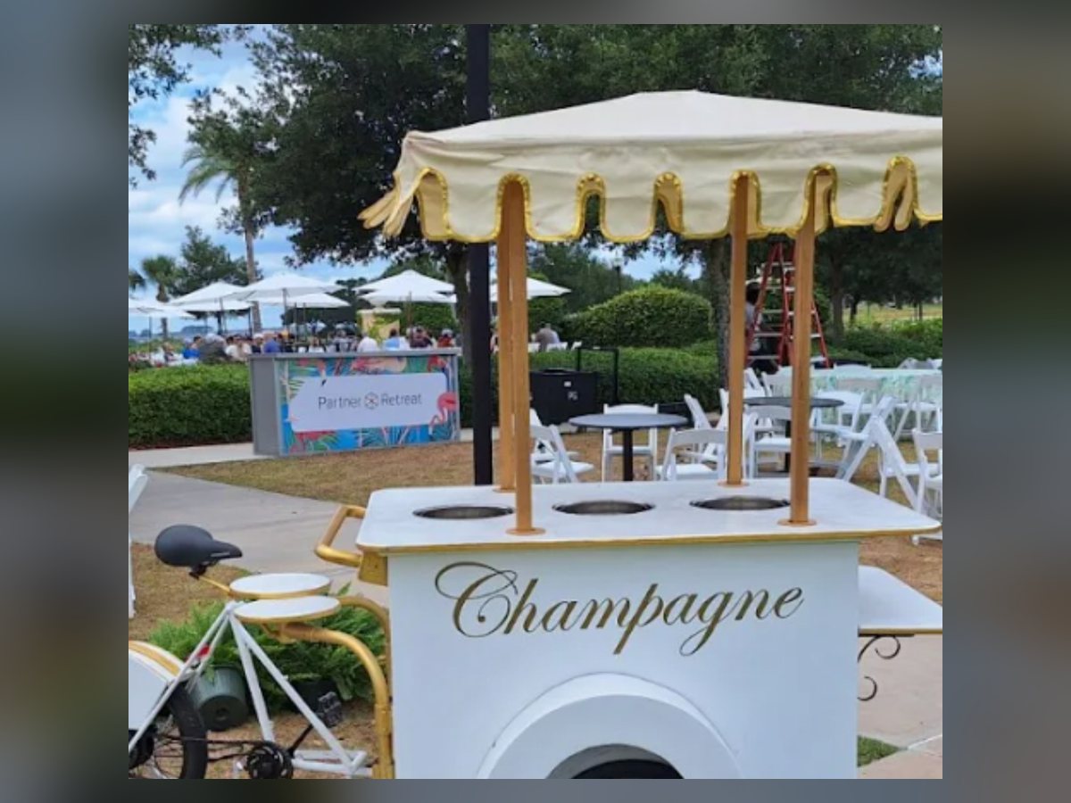 White champagne cart with scalloped canopy