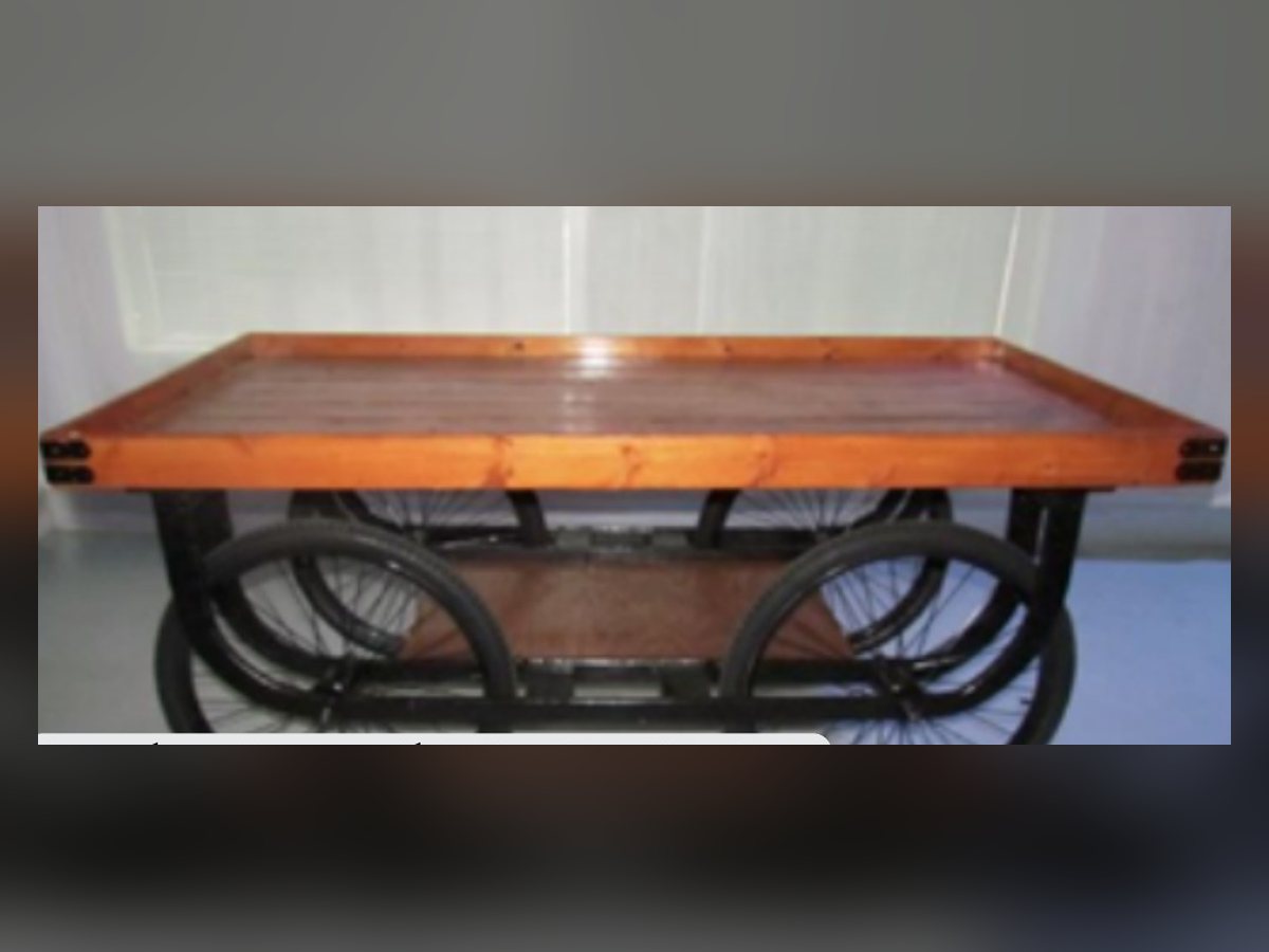 Flat wooden action station vendor cart on spoke wheels