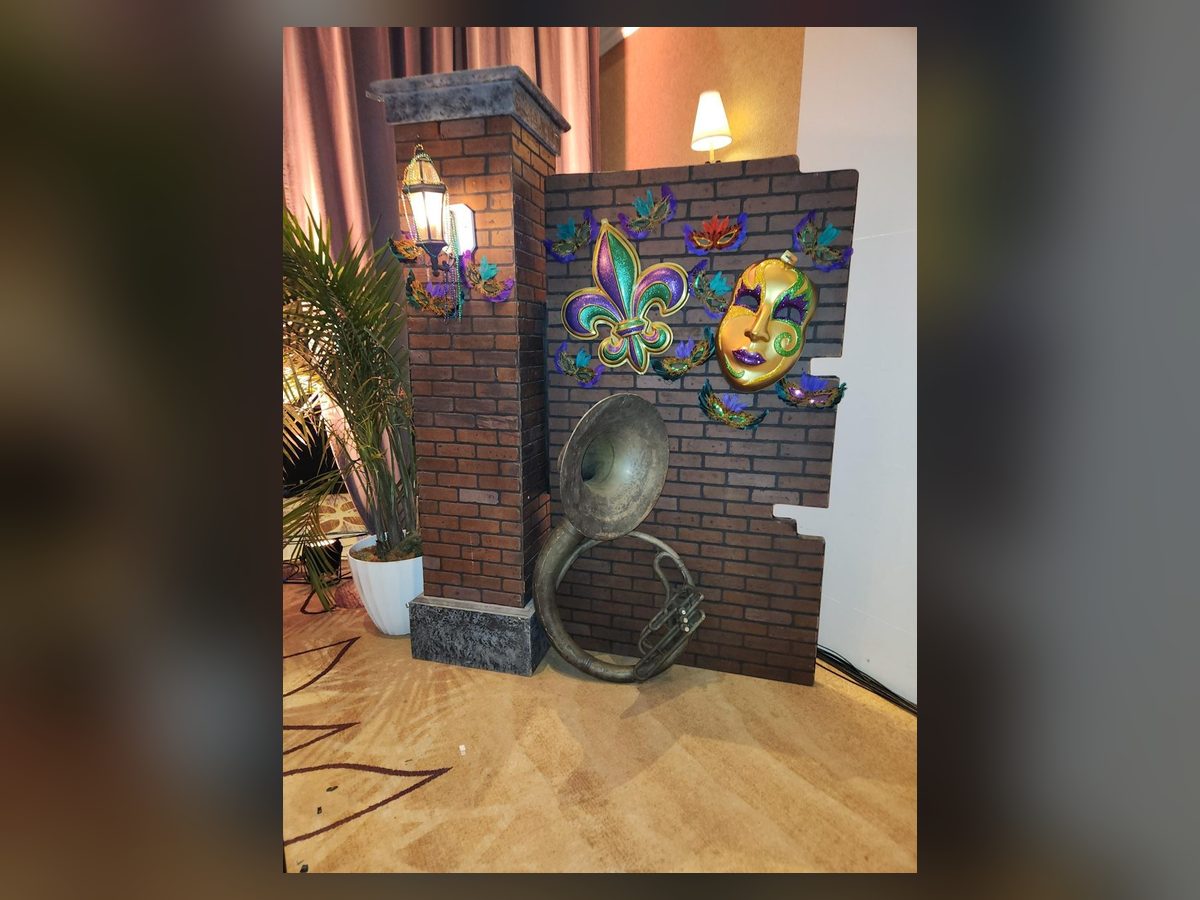 Mardi Gras brick wall vignette with masks and lantern