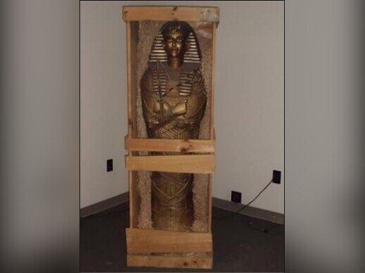 Egyptian sarcophagus statue in wooden crate