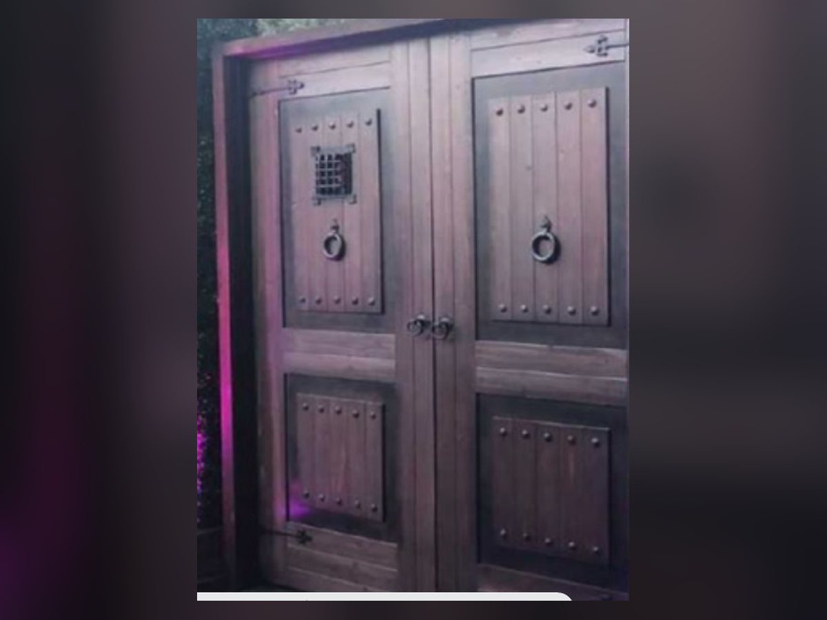 Wooden speakeasy double doors with peep windows
