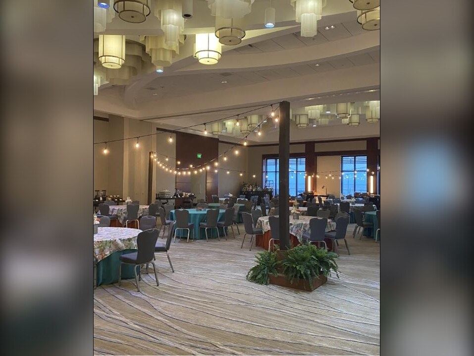 Festoon string lighting over event space