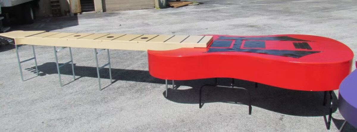 Red Thunderbird guitar-shaped buffet table