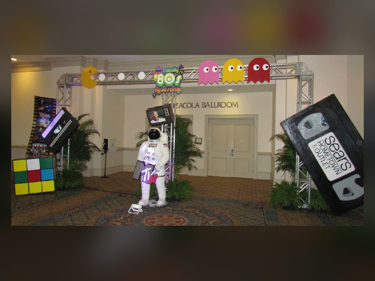 Oversized VHS tape prop in an 80s vignette
